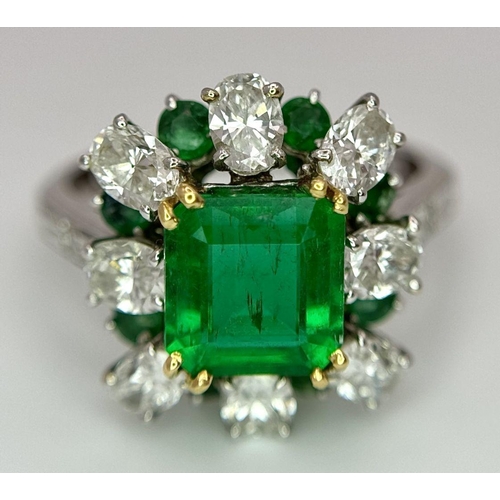 4 - A Stunning Emerald and Diamond Ring. Emerald cut centre emerald - 2.5ct with an emerald -0.8ctw and ... 