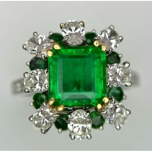 4 - A Stunning Emerald and Diamond Ring. Emerald cut centre emerald - 2.5ct with an emerald -0.8ctw and ... 