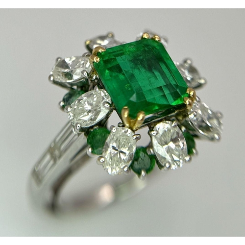 4 - A Stunning Emerald and Diamond Ring. Emerald cut centre emerald - 2.5ct with an emerald -0.8ctw and ... 