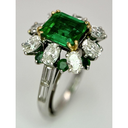 4 - A Stunning Emerald and Diamond Ring. Emerald cut centre emerald - 2.5ct with an emerald -0.8ctw and ... 