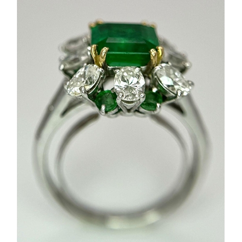 4 - A Stunning Emerald and Diamond Ring. Emerald cut centre emerald - 2.5ct with an emerald -0.8ctw and ... 