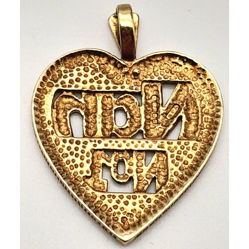 404 - A 9K YELLOW GOLD 'NUMBER 1 NAN' HEART PENDANT. 2.3G