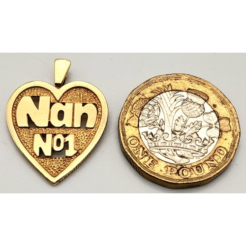 404 - A 9K YELLOW GOLD 'NUMBER 1 NAN' HEART PENDANT. 2.3G