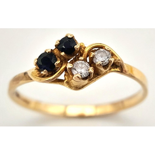 414 - An 18ct Yellow Gold Diamond and Sapphire Four Stone Ring. Size O. Set with Two 2mm Round Cut Diamond... 