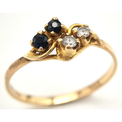 414 - An 18ct Yellow Gold Diamond and Sapphire Four Stone Ring. Size O. Set with Two 2mm Round Cut Diamond... 