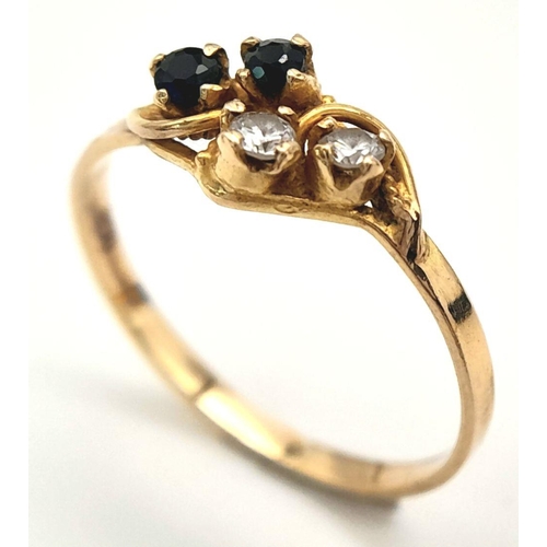 414 - An 18ct Yellow Gold Diamond and Sapphire Four Stone Ring. Size O. Set with Two 2mm Round Cut Diamond... 