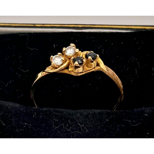 414 - An 18ct Yellow Gold Diamond and Sapphire Four Stone Ring. Size O. Set with Two 2mm Round Cut Diamond... 