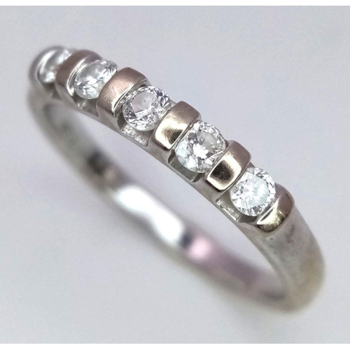 425 - A 9K WHITE GOLD DIAMOND BAND RING. 0.25CT. 1.8G. SIZE L.