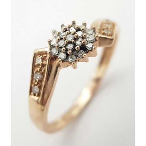 432 - A 9K ROSE GOLD DIAMOND CLUSTER RING. 2.2G. SIZE O 1/2.