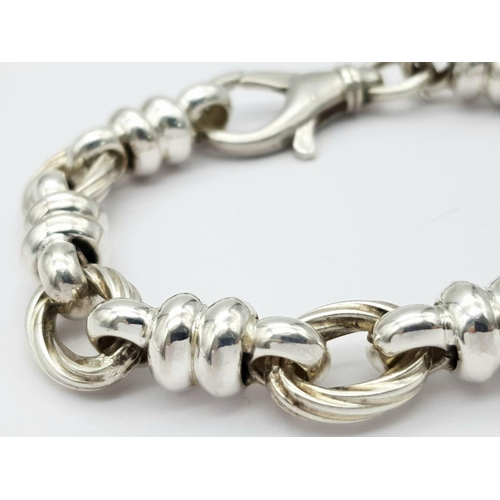 446 - A STERLING SILVER FANCY LINK BRACELET 30.5G , 22.5CM LENGTH.

ref: 8523