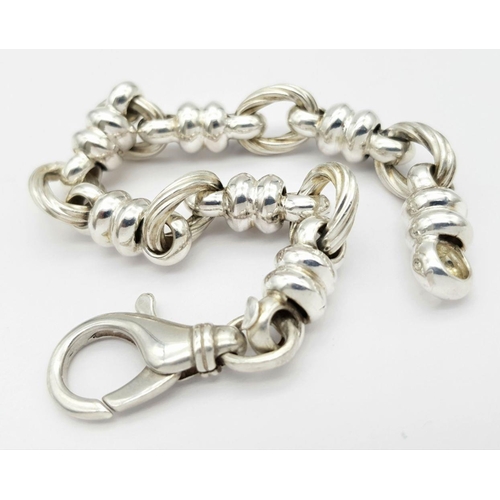 446 - A STERLING SILVER FANCY LINK BRACELET 30.5G , 22.5CM LENGTH.

ref: 8523