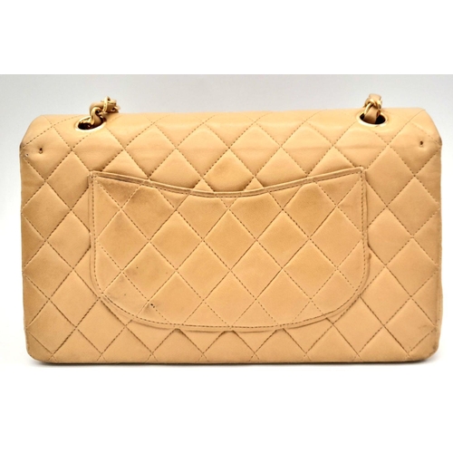 45 - A Beige Chanel Classic Matelasse Double Flap Bag. Quilted leather exterior with gold-toned hardware,... 