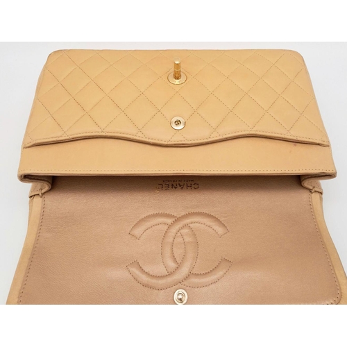 45 - A Beige Chanel Classic Matelasse Double Flap Bag. Quilted leather exterior with gold-toned hardware,... 