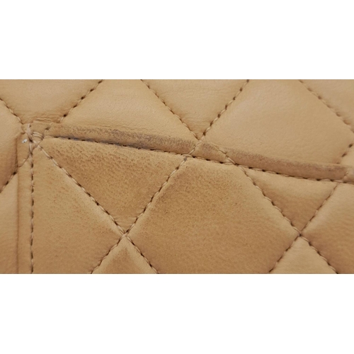 45 - A Beige Chanel Classic Matelasse Double Flap Bag. Quilted leather exterior with gold-toned hardware,... 