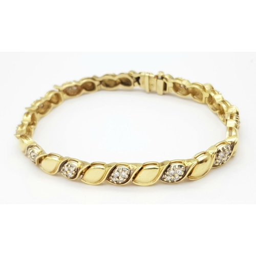 5 - A 14K YELLOW GOLD DIAMOND BRACELET - 0.72CT. 22.7G TOTAL WEIGHT.