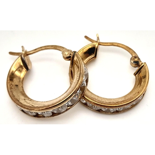 563 - A Pair of 9k Yellow Gold CZ Hoop Earrings. 2.5g total weight.