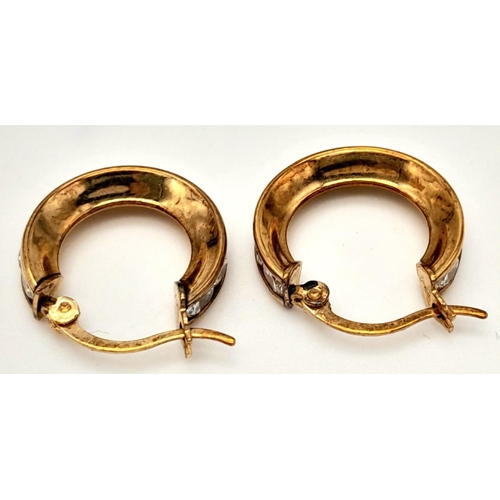 563 - A Pair of 9k Yellow Gold CZ Hoop Earrings. 2.5g total weight.