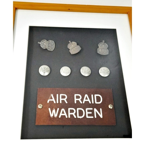 569 - A Vintage Framed and Glazed Original Set of WW2 Air Raid Warden Items Comprising 1) Three Silver ARP... 