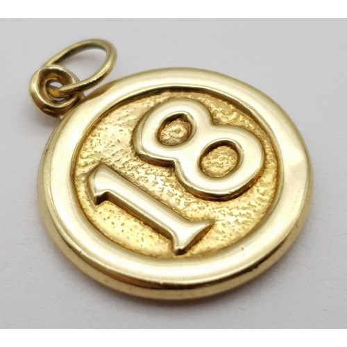 748 - A 9K YELLOW GOLD DOUBLE SIDED 18 CHARM / PENDANT. 0.6G