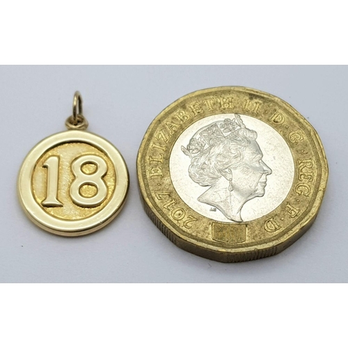 748 - A 9K YELLOW GOLD DOUBLE SIDED 18 CHARM / PENDANT. 0.6G