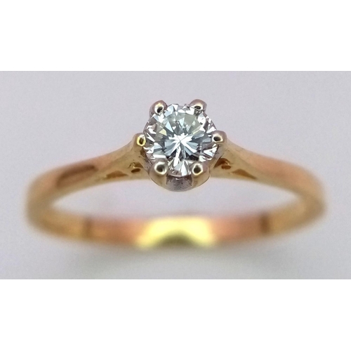 89 - AN 18K YELLOW GOLD DIAMOND SOLITAIRE RING. 0.20CT. 1.9G. SIZE O