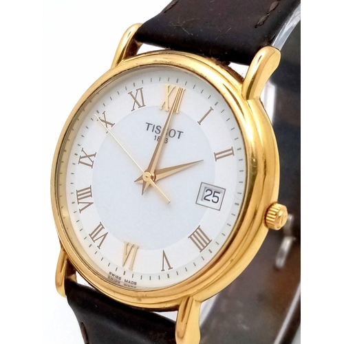 122 - AN 18K GOLD TISSOT