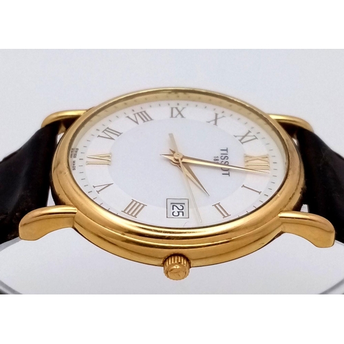 122 - AN 18K GOLD TISSOT