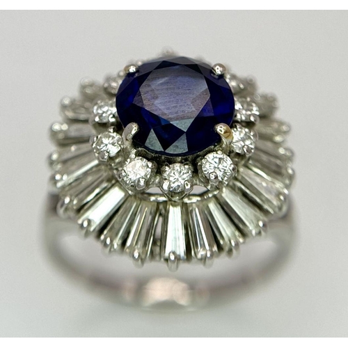 15 - A Gorgeous Sapphire and Diamond Platinum Ring. A deep blue 2.88ct round cut sapphire with a double h... 