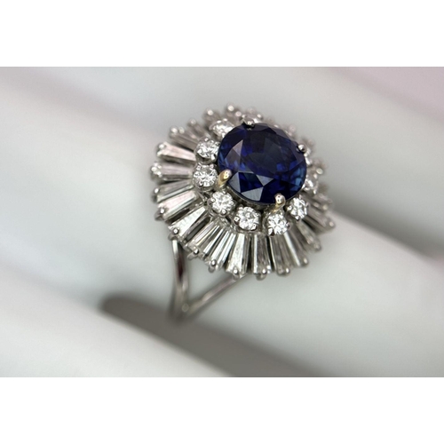 15 - A Gorgeous Sapphire and Diamond Platinum Ring. A deep blue 2.88ct round cut sapphire with a double h... 