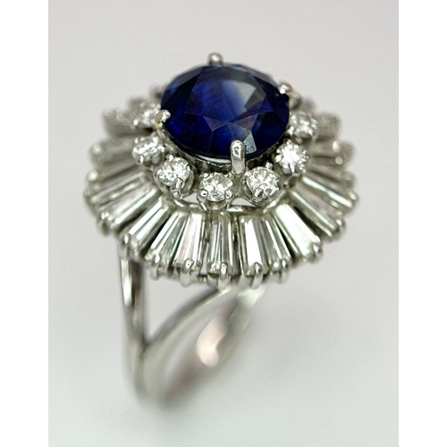 15 - A Gorgeous Sapphire and Diamond Platinum Ring. A deep blue 2.88ct round cut sapphire with a double h... 