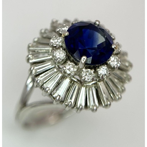 15 - A Gorgeous Sapphire and Diamond Platinum Ring. A deep blue 2.88ct round cut sapphire with a double h... 