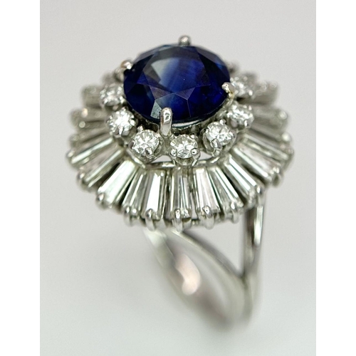 15 - A Gorgeous Sapphire and Diamond Platinum Ring. A deep blue 2.88ct round cut sapphire with a double h... 