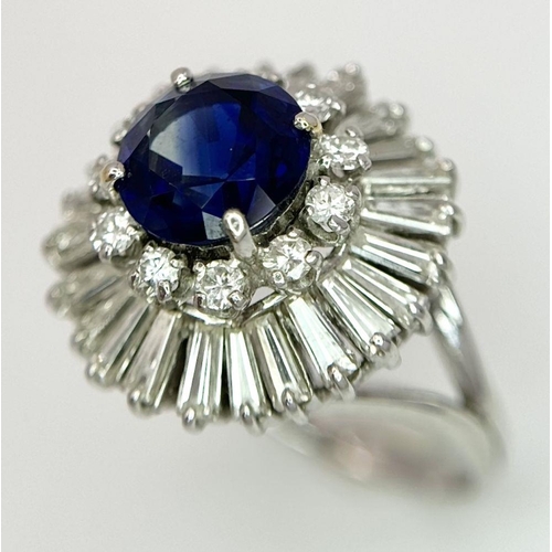 15 - A Gorgeous Sapphire and Diamond Platinum Ring. A deep blue 2.88ct round cut sapphire with a double h... 