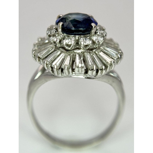 15 - A Gorgeous Sapphire and Diamond Platinum Ring. A deep blue 2.88ct round cut sapphire with a double h... 