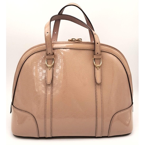 157 - A Gucci Dusty Pink Monogram Nice Dome Bag. Patent leather exterior with gold-toned hardware, two-ton... 