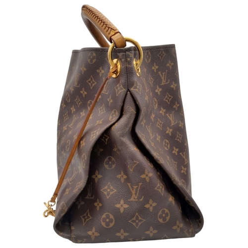 171 - A Brown Louis Vuitton Artsy MM Monogram shoulder bag. Leather exterior with signature Monogram canva... 