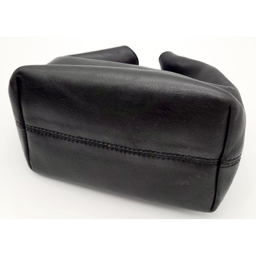 178 - A Prada Wrist Mini Leather Ring Handle Bag. Black nappa leather with maxi ring-shaped handle in silv... 