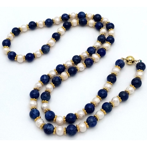 191 - A Lapis Lazuli and Cultured Pearl Matinee Necklace. 8mm beads and pearls. Gilded spacers and clasp. ... 