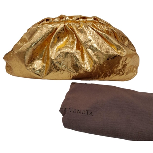 192 - A Bottega Veneta Gold Metallic Leather Pouch Clutch Bag. Stunning gold leather exterior with a large... 