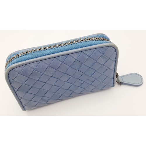 310 - A Bottega Veneta Intrecciato Light Blue Woven Leather Purse. Wrap around zipper closure, brass-tone ... 