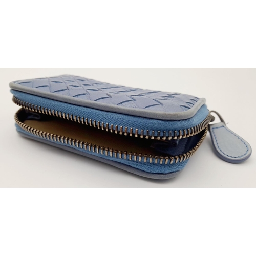 310 - A Bottega Veneta Intrecciato Light Blue Woven Leather Purse. Wrap around zipper closure, brass-tone ... 