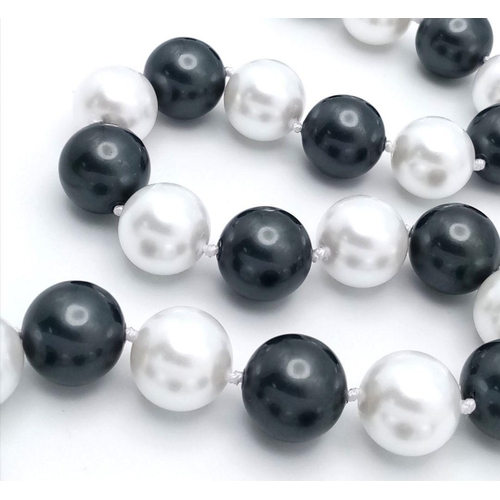 367 - A Fashionable Black and White South Sea Pearl Shell Beaded Necklace. Large 14mm beads. 44cm necklace... 