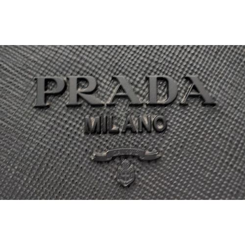 409 - A Black Prada Saffiano Cuir Leather Monochrome Tote Bag. Leather exterior, gold-tone hardware, two r... 