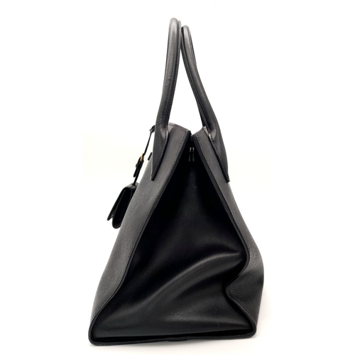 409 - A Black Prada Saffiano Cuir Leather Monochrome Tote Bag. Leather exterior, gold-tone hardware, two r... 