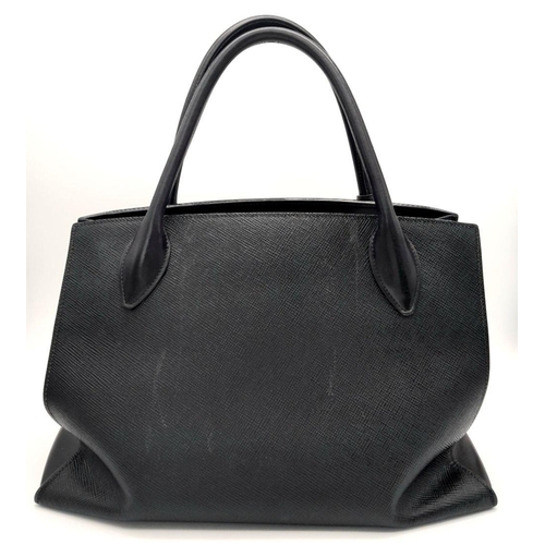 409 - A Black Prada Saffiano Cuir Leather Monochrome Tote Bag. Leather exterior, gold-tone hardware, two r... 