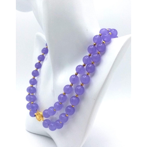 438 - A Gorgeous Lavender Jade Two Row Beaded Necklace. 10mm beads with gilded spacers and clasp. 44cm nec... 