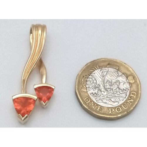 50 - A 14K Yellow Gold Double Fire Opal Pendant. Trillion cuts. 4cm. 5.5g total weight. Ref: 017280