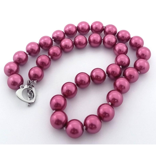 585 - A Hot Pink South Sea Pearl Shell Beaded Necklace with Heart Clasp. 12mm beads. 42cm necklace length.