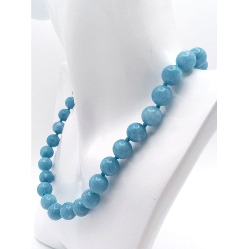 642 - A Natural Aquamarine Water Pattern Beaded Matinee Length Necklace. 90cm necklace length. 10mm beads.