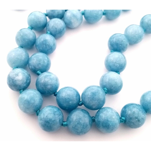 642 - A Natural Aquamarine Water Pattern Beaded Matinee Length Necklace. 90cm necklace length. 10mm beads.